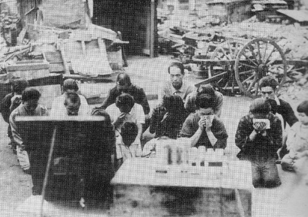 Japanese civilians listening to the surrender broadcast 